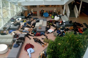 Students hold a "die-in" in opposition to police brutality. Photo by Sarah Eames.