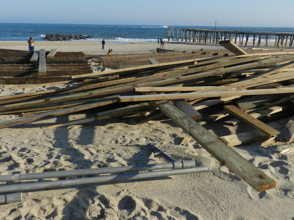 Boardwalk wood rests on the beach. Photo by Natalie De Gaetano.