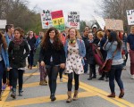 Vassar students armed with signs of their own march down the road toward the Westboro Baptist Church members. Photo by Tim Smith.