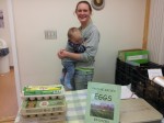 Becky Fullman and her son sell fresh eggs from Old Ford Farm. The family-run farm produces eggs, chicken, pork and vegetables. Photo by Kelly Fay.