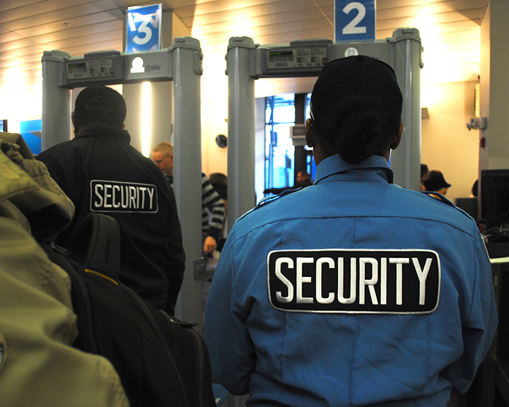 Once visitors wait in the line and make it to the first stop in the security process they have to go through what very much resembles airport security customs. After removing all outerwear, belts, electronics, etc., and putting them in a bin to go through the scanner, one must walk through the arch scanner. The room is filed with security guards moving people along and making sure everything is running smoothly. Photo by Emily DeFranco.