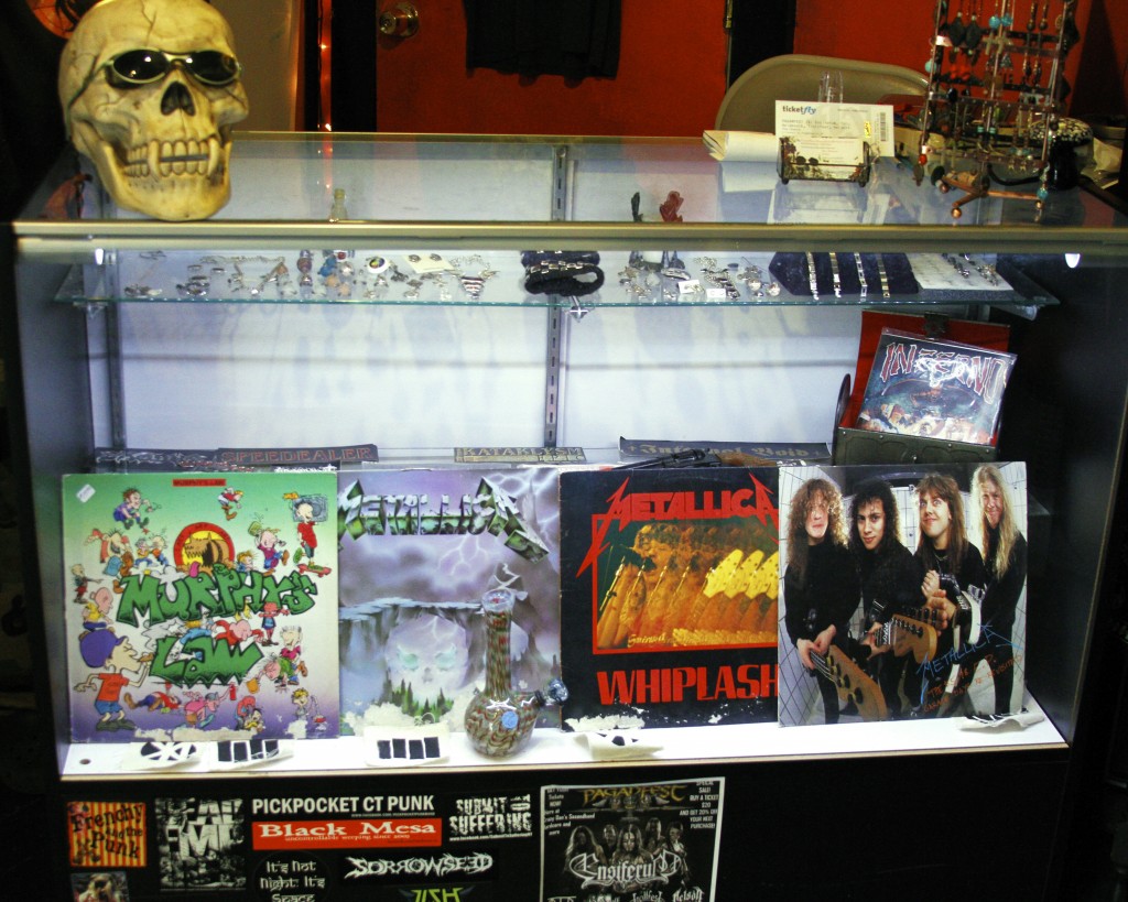 The main display holds three hard to find Metallica albums that Dan has confessed to becoming attached to. The album on the far right is a rare vinyl of Metallica, live in concert. Photo by Tim Smith