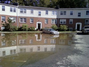 Flood waters crept up the parking lot at Town and Country Condominiums on Huguenot