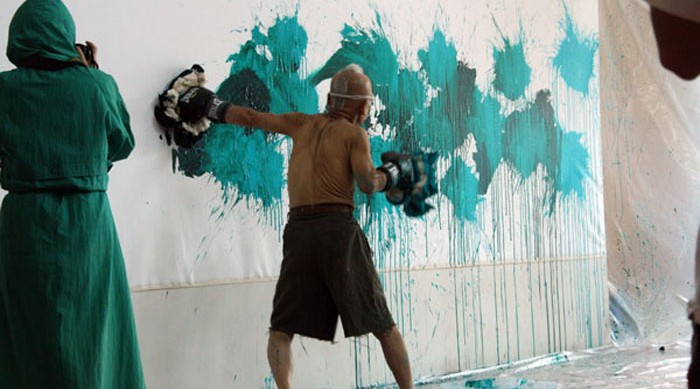 Ushio Shinohara shows his method of "Boxing Painting." Photo by Ethan Genter.