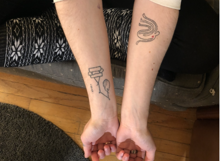 Renee Ricci, a third-year metalworking major, shows tattoos she’s done on herself. The one on the left is a depiction of a machine she created in Florida.